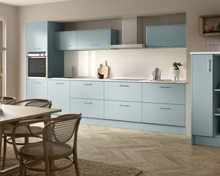 Pastel kitchen scheme with light blue cabinets and minimalist aesthetic