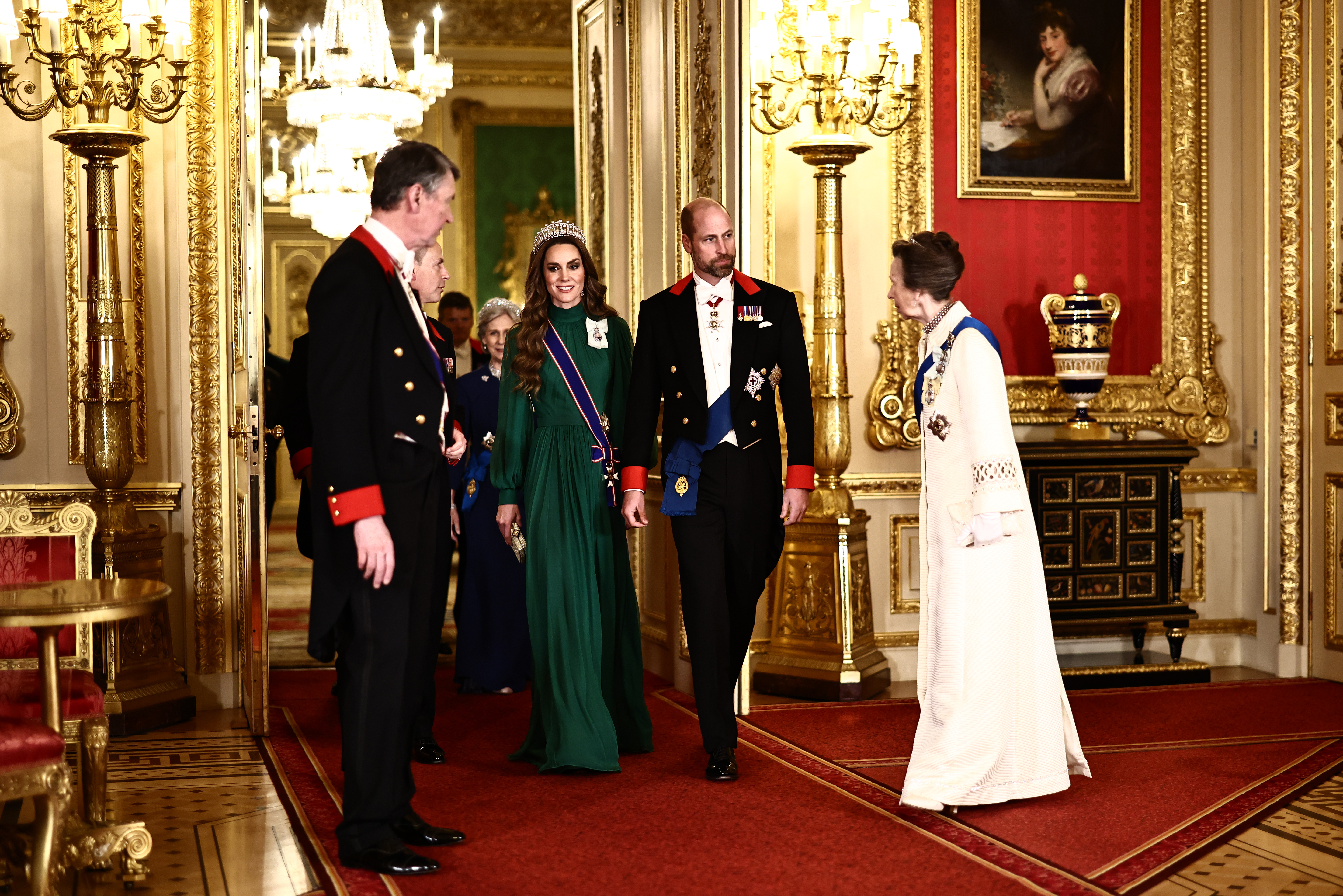 Princess Kate and Prince William walking into a state banquet with Princess Anne and Sir Tim Laurence