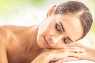 Tanned woman resting in sun