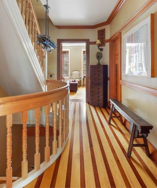 hallway with striped wooden floor