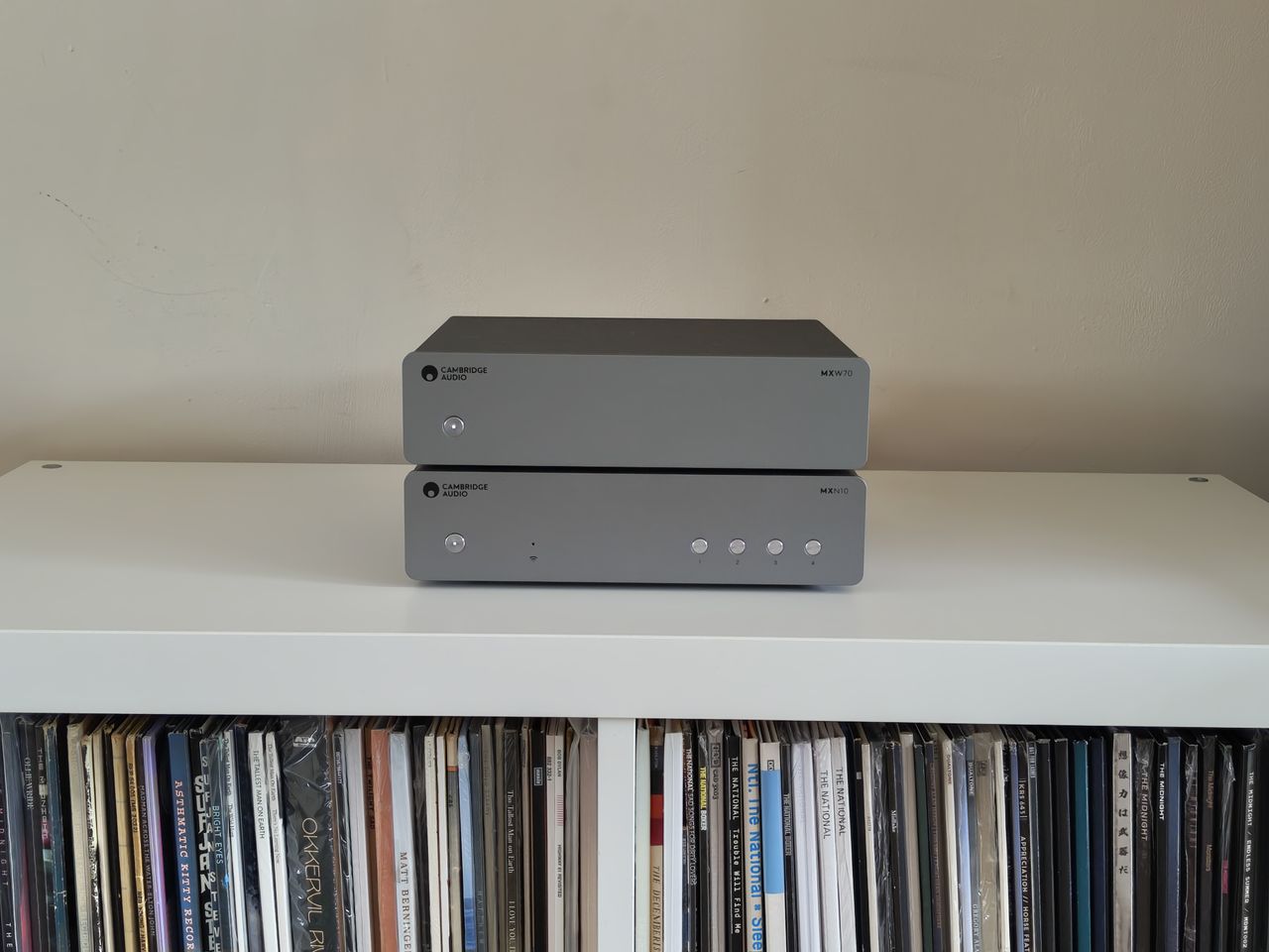 Cambridge Audio MXW70 power amp on book shelf with streamer
