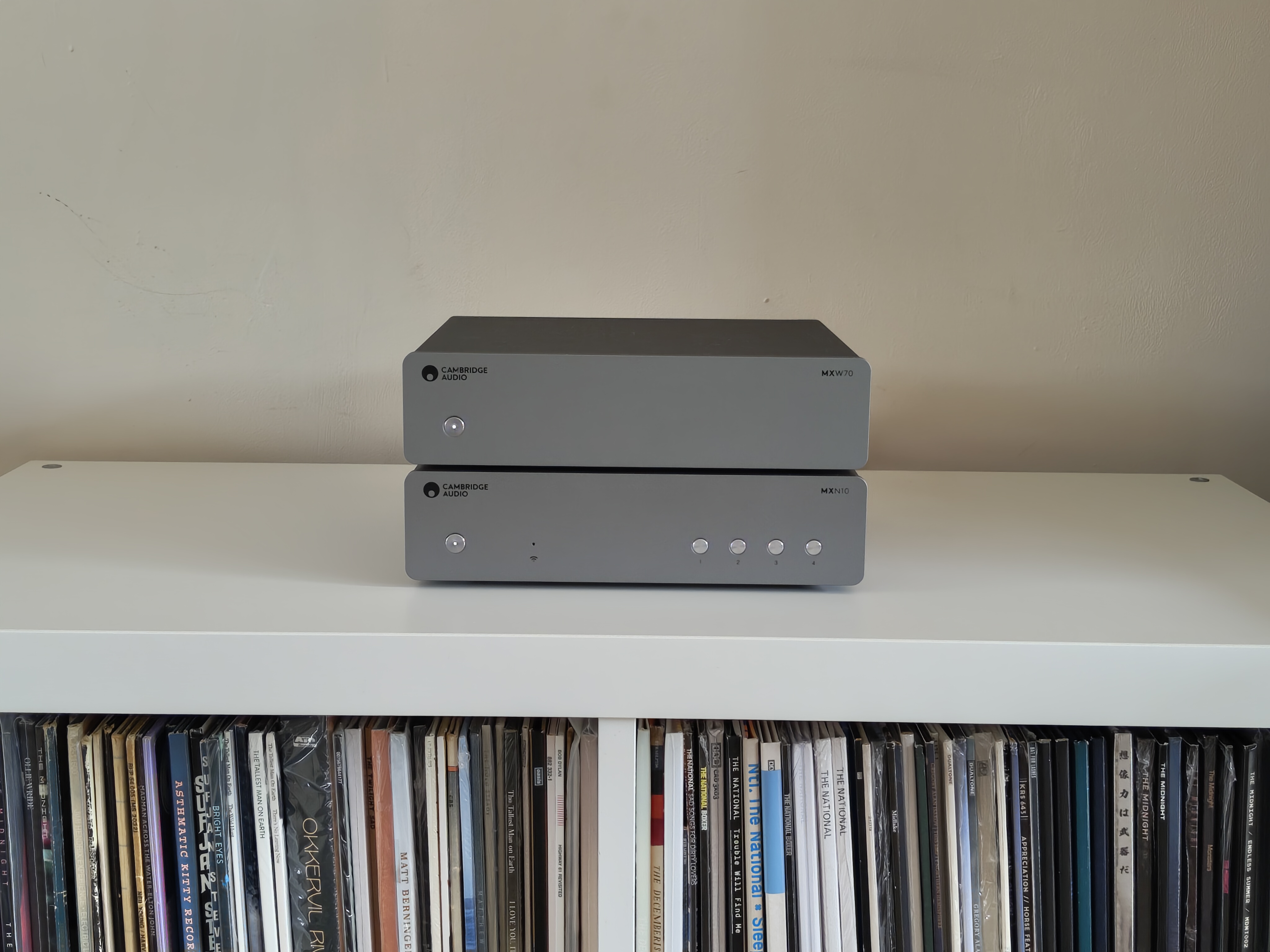 Cambridge Audio MXW70 power amp on book shelf with streamer
