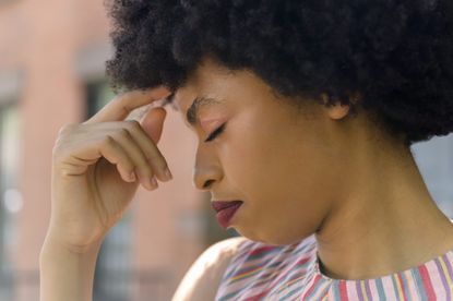 Menstrual migraines: Young woman with headache