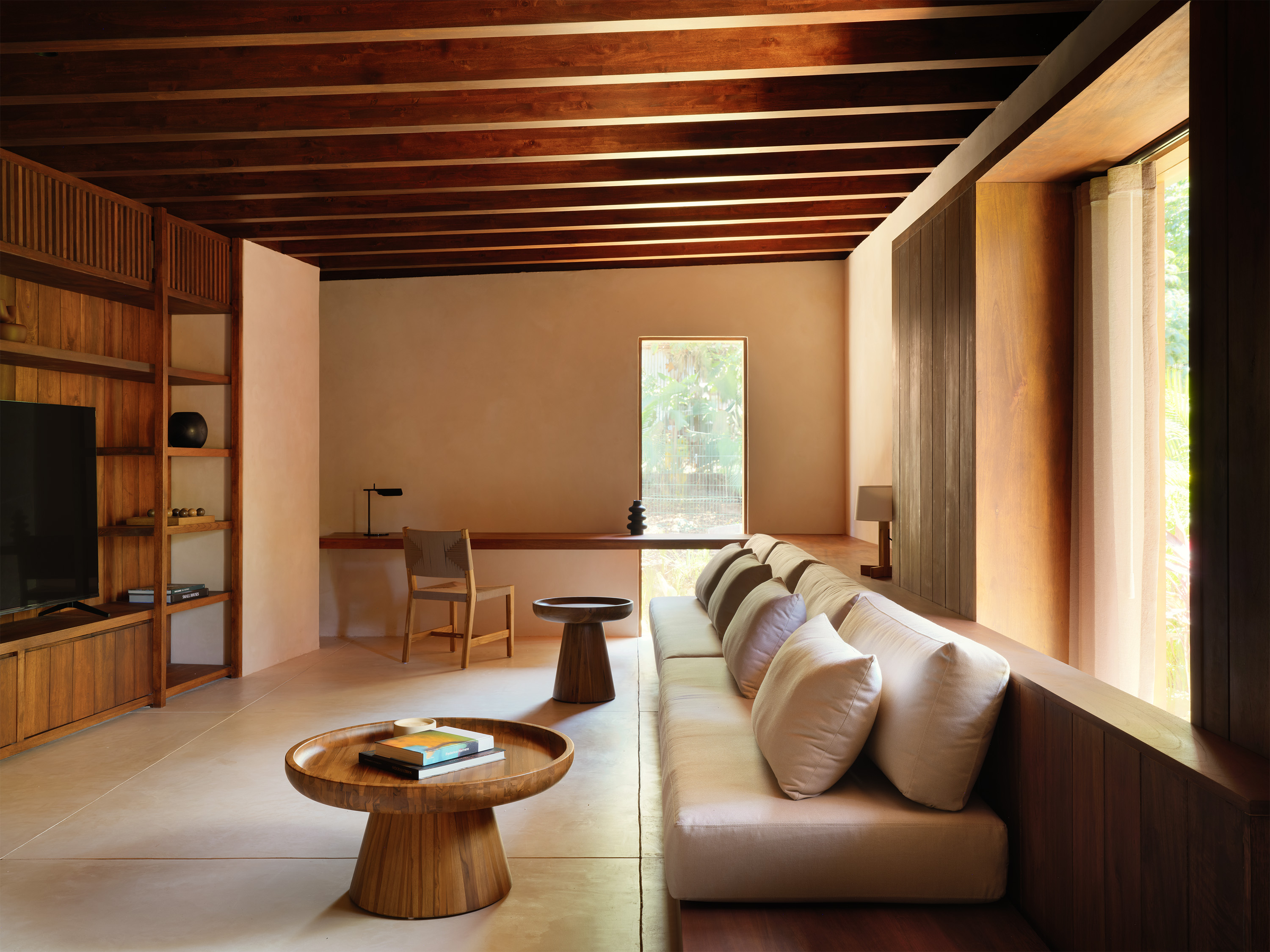 a sculptural Patio house in Costa Rica, textured, low volumes among tropical greenery