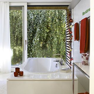 bathroom with bathtub and white sliding window