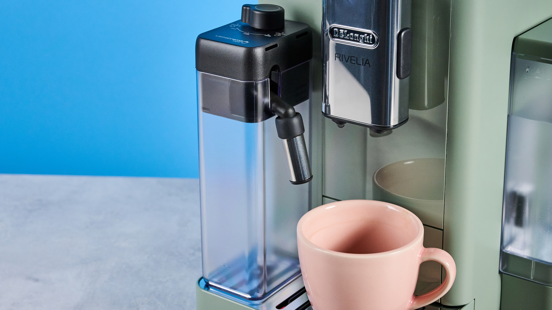 the de'longhi rivelia automatic superautomatic coffee machine in sage green with a bright LED screen, two interchangeable bean hoppers, an automatic milk frother, and a huge range of coffee recipes