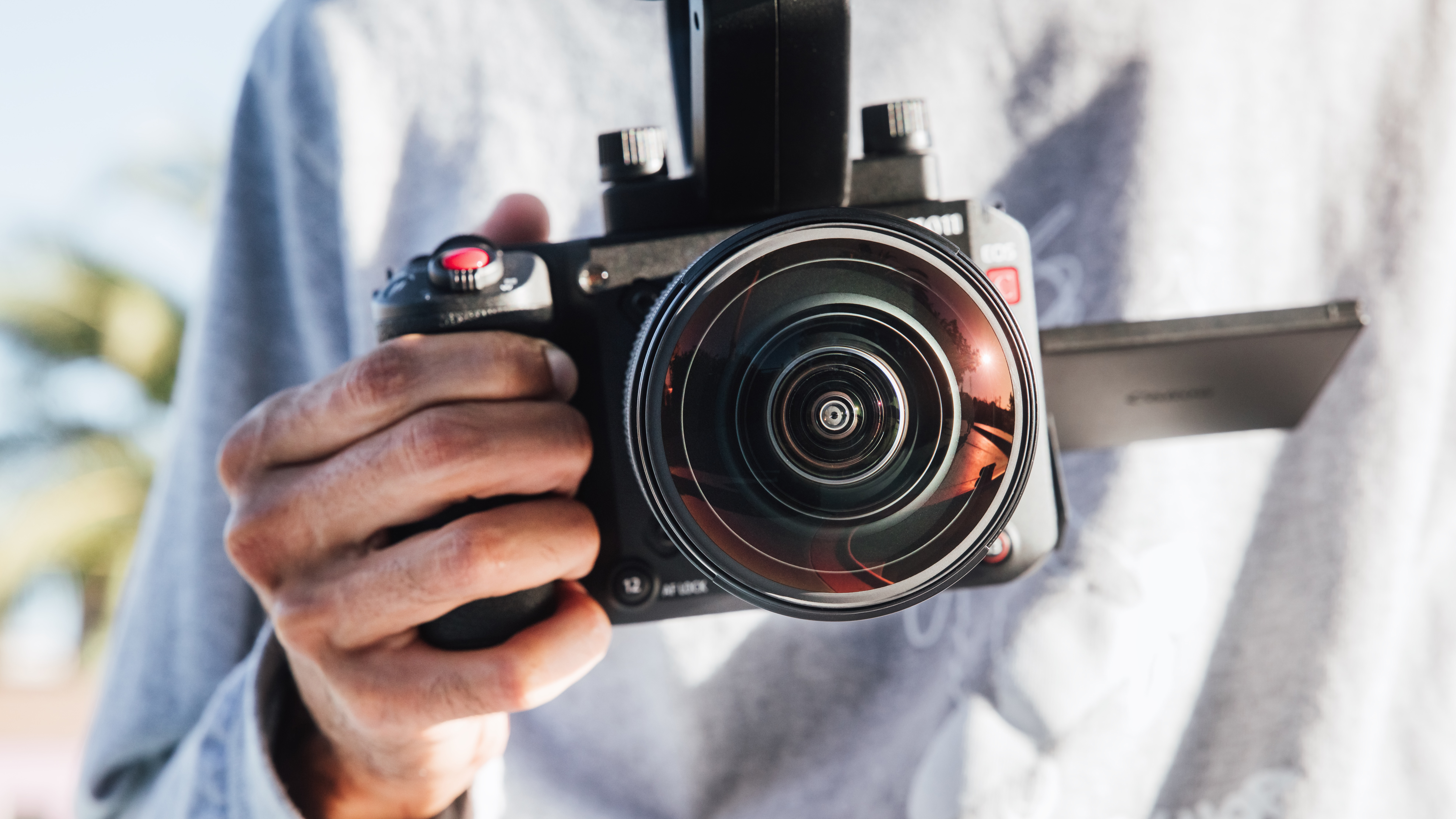 A photographer using the Canon RF 7-14mm f/2.8-3.5L Fisheye STM