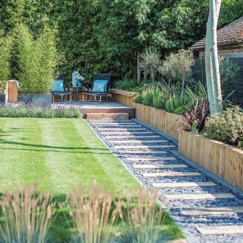 garden with blue cushion and green lawn