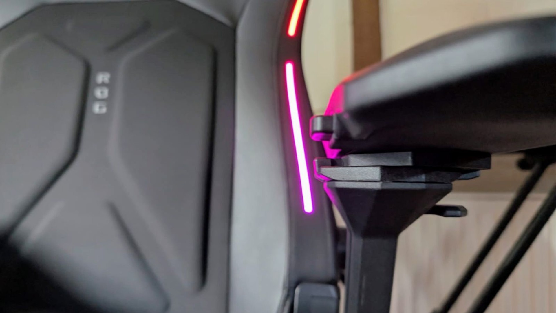 Close up on Asus ROG Courser arm rest with RGB lighting switched on