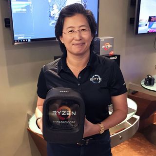 AMD CEO Lisa Su holding a mini ITX PC. Er, Threadripper packaging.