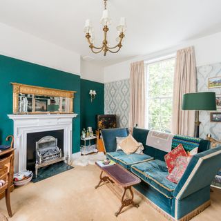 living room with green wall and fire place