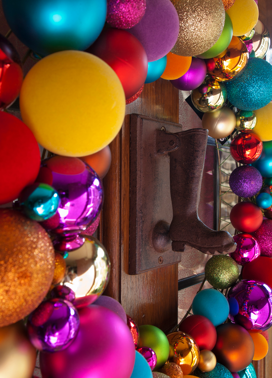 close up picture of a brightly coloured bauble wreath