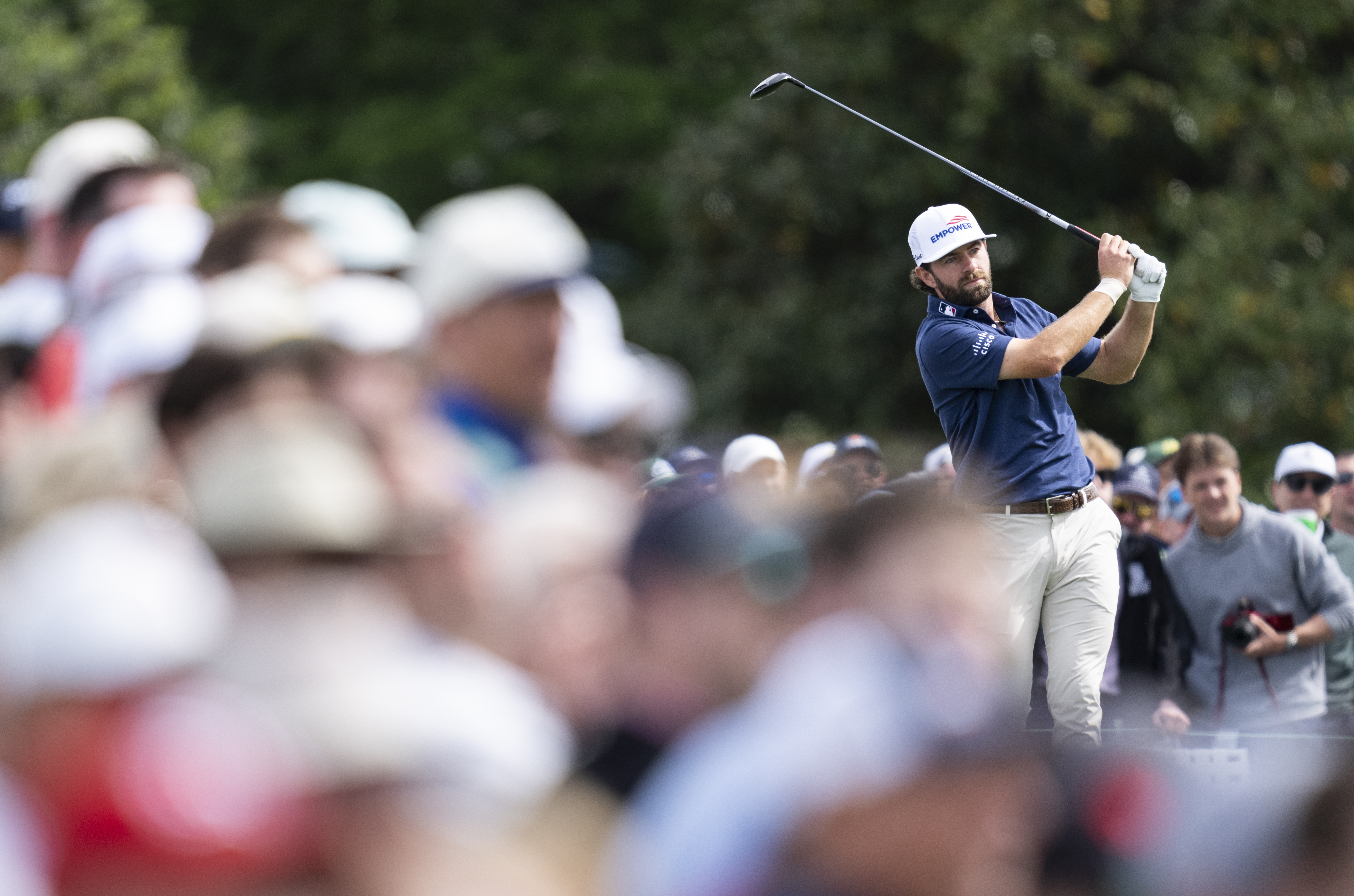 Cameron Young plays a stroke from the No. 10 tee during a practice round prior to the Masters at Augusta National Golf Club