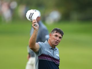 Padraig Harrington with his cap off and in his hand, thanking the crowds for their support