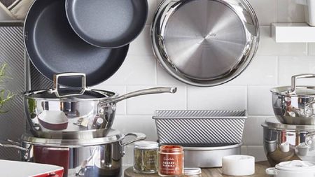 A kitchen with stainless steel pots and pans from Sur La Table.