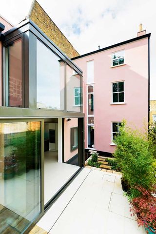 Glazed extension to pink painted house