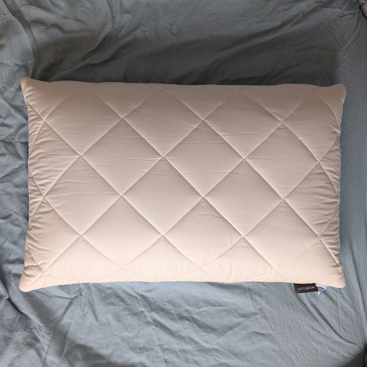 The Woolroom Natural Latex Washable Wool Pillow being tested