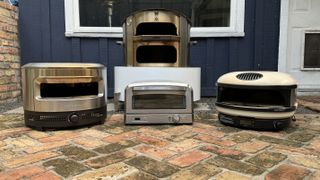 solo stove, gozney arc, cuisinart and breeo pizza ovens arranged for group photo during testing
