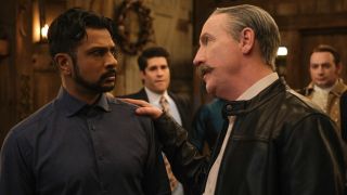 Jay looking scared as Elias puts his right hand on Jay's shoulder.