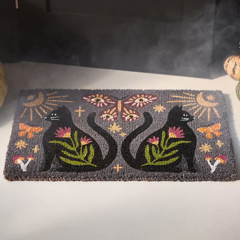 grey doormat with cats, butterflies and flowers on
