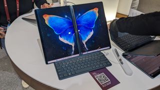A Lenovo Yoga Book 9i photographed on-stand at the MWC 2023 event.