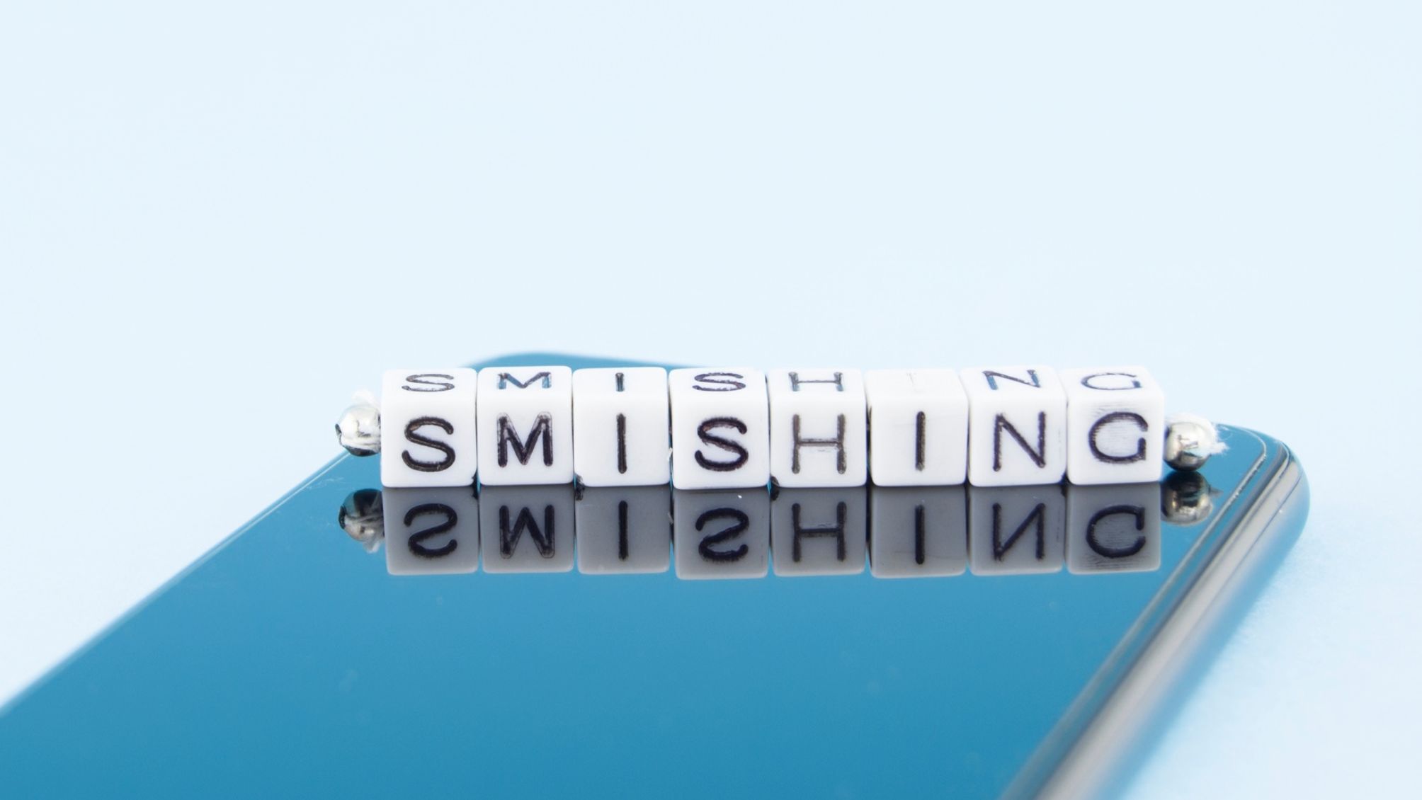 The word SMISHING is spelled out in beads.