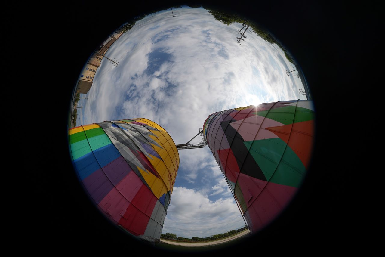 An image sample from the Sony FE 8-14mm f/3.5 Fisheye G of colorful silos