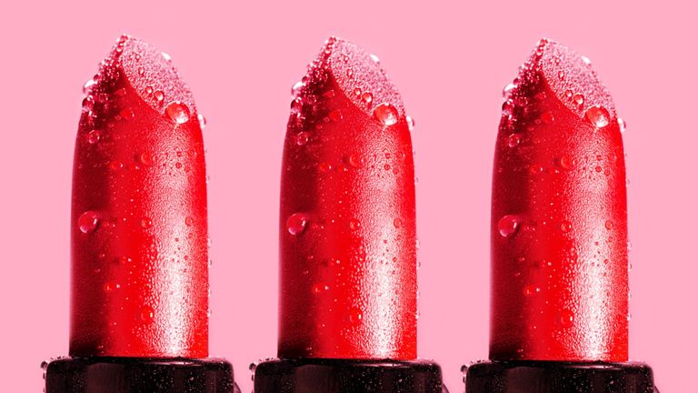 Beauty pattern made of Red Lipstick on Pink background