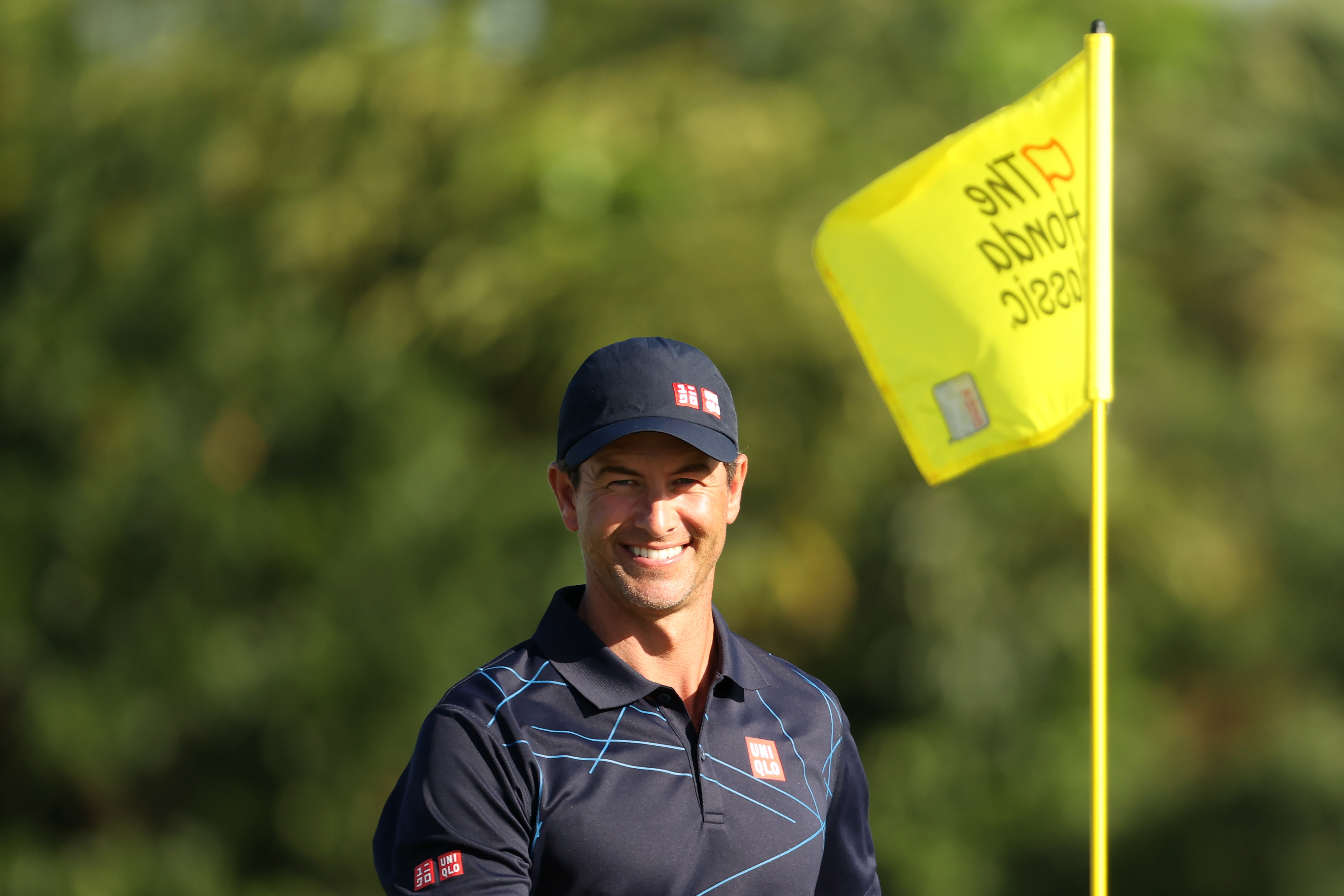 Adam Scott in front of a Honda Classic flag
