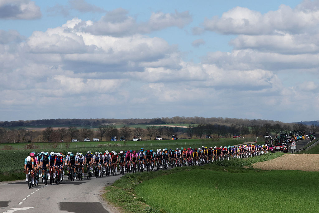 The pack rides during the 2nd stage of the Paris-Nice cycling race, 187 km between &amp;Eacute;p&amp;ocirc;ne and Montargis, on March 9, 2026. (Photo by Anne-Christine POUJOULAT / AFP)