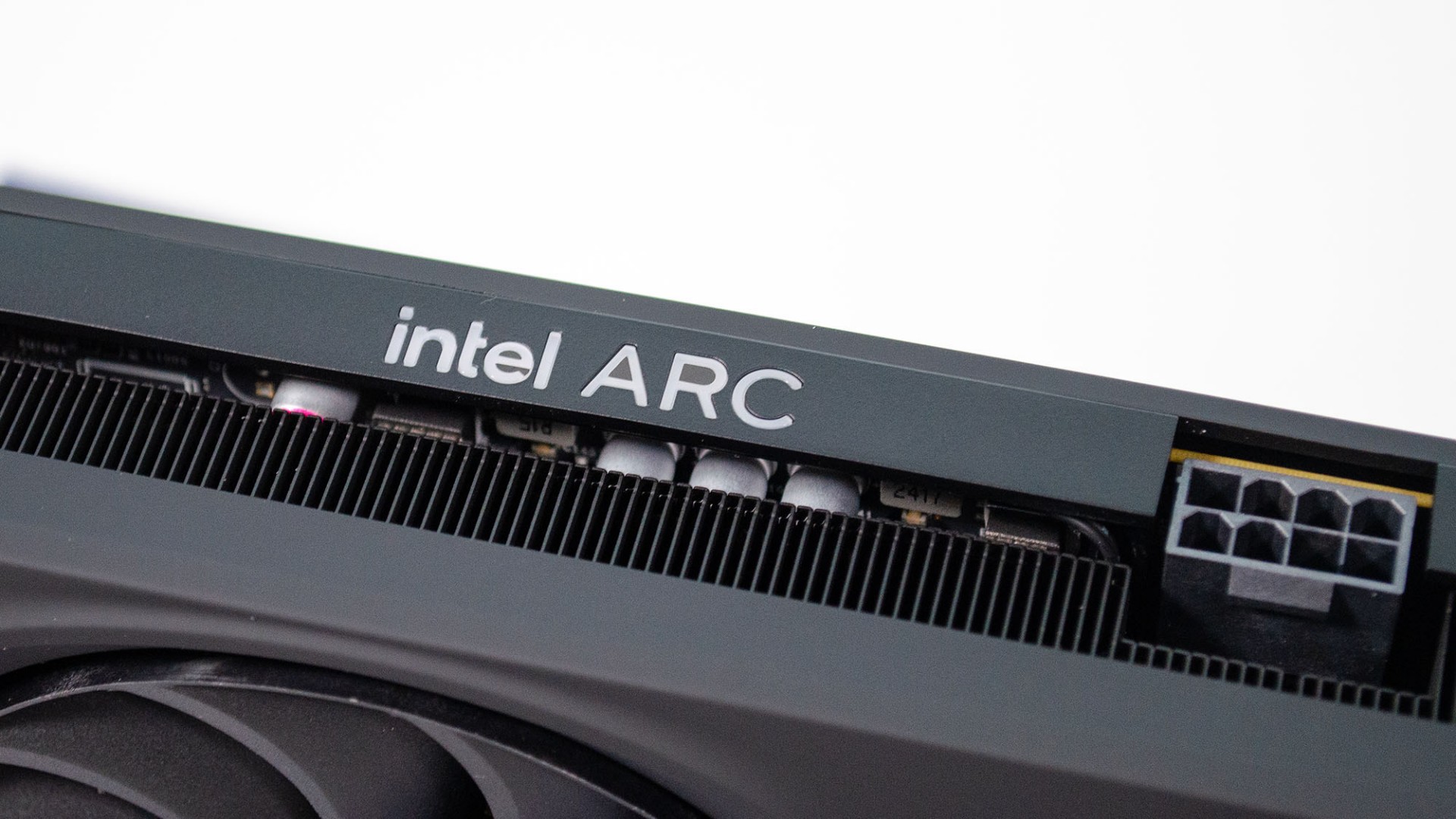 Intel Arc B580 graphics card showing PCIe power connector and logo.