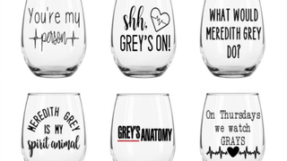 Grey's Anatomy quotes and logos adorn stemless wine glasses.