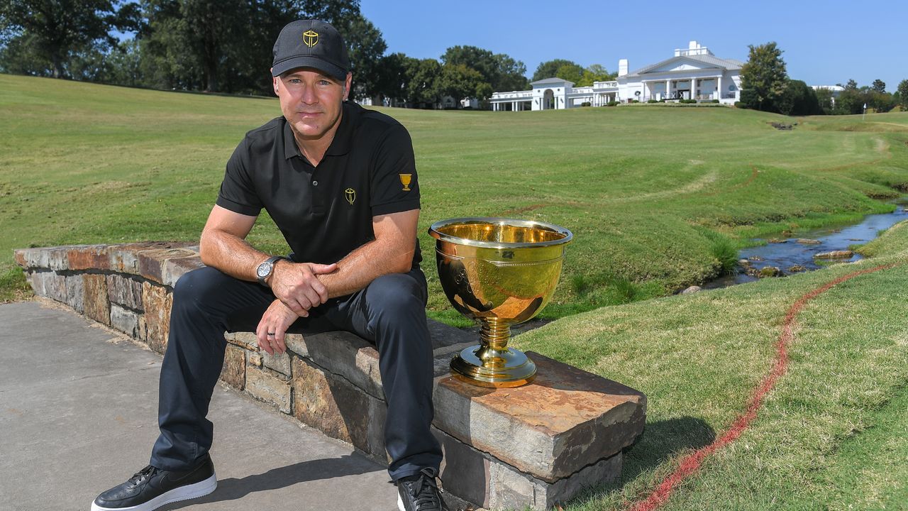 Trevor Immelman poses with the Presidents Cup during the Captains Visit for the 2022 Presidents Cup at Quail Hollow Club