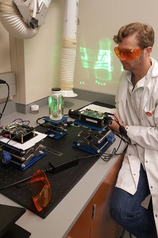 Alexander Lippert, a researcher at Southern Methodist University in Texas, demonstrates his 3D Light Pad technology.