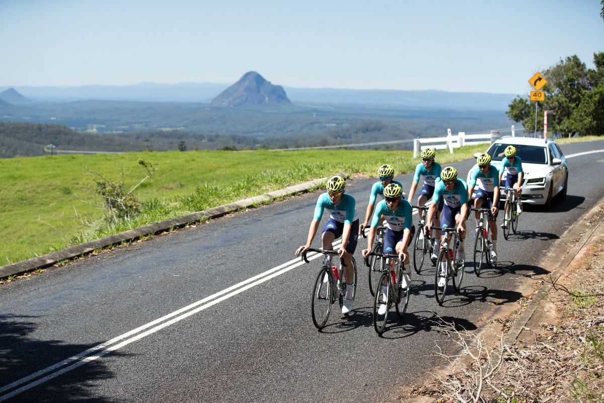 The team with the Glass House Mountains in the background