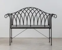 A black metal decorative outdoor bench