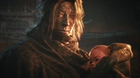 A masked man holds a baby