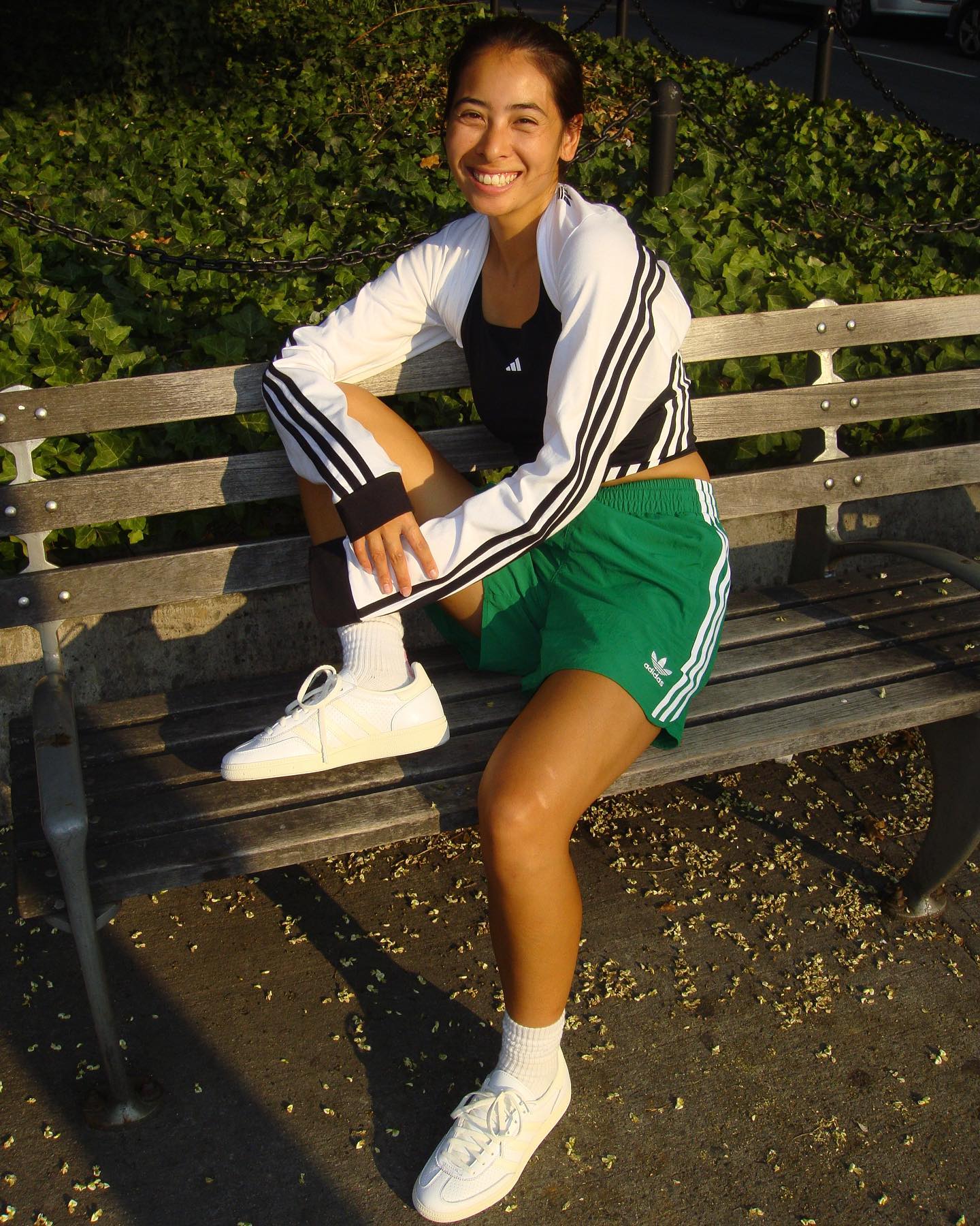 woman wearing white sneakers