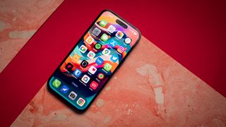 iPhone 14 Pro Dynamic Island on red background