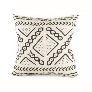 A cream and black aztec print outdoor cushion