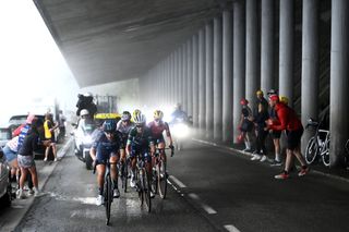 Juliette Labous (Team DSM) leads the chase behind Kasia Niewiadoma (Canyon-SRAM) through one of the avalanche protection tunnels