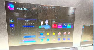 LG Display transparent OLED 55-inch TV showing weather