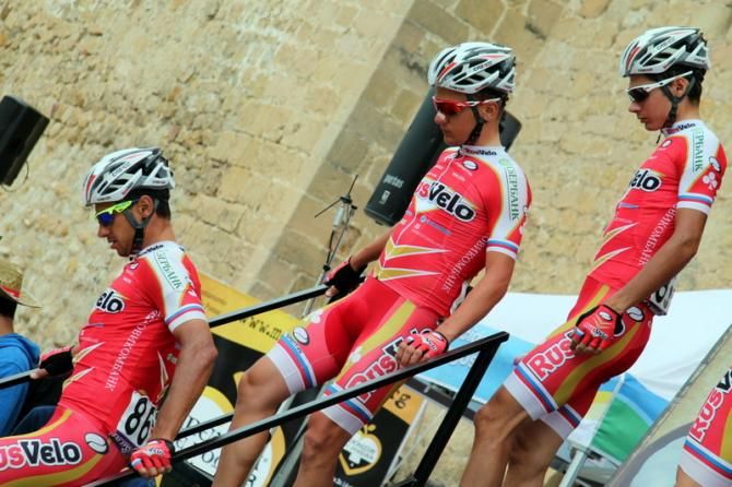 Three Rusvelo riders getting off stage