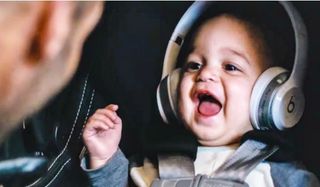 Baby wearing headphones in The Fate Of The Furious