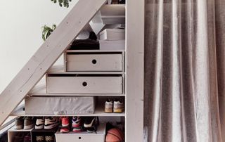IKEA storage boxes and organization ideas for small spaces under a mezzanine bed