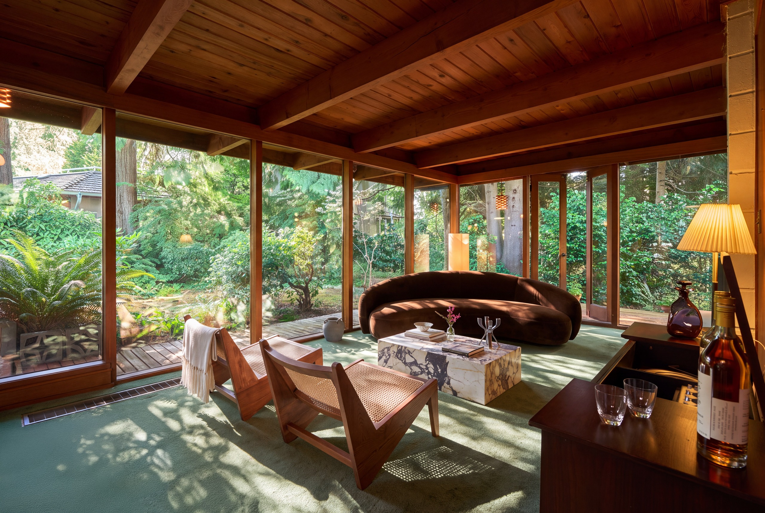 The house is integrated into a mature private garden