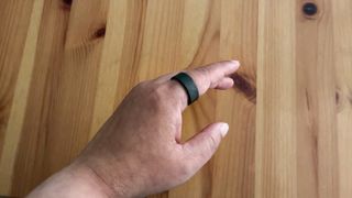 The Ultrahuman Ring Air on an index finger