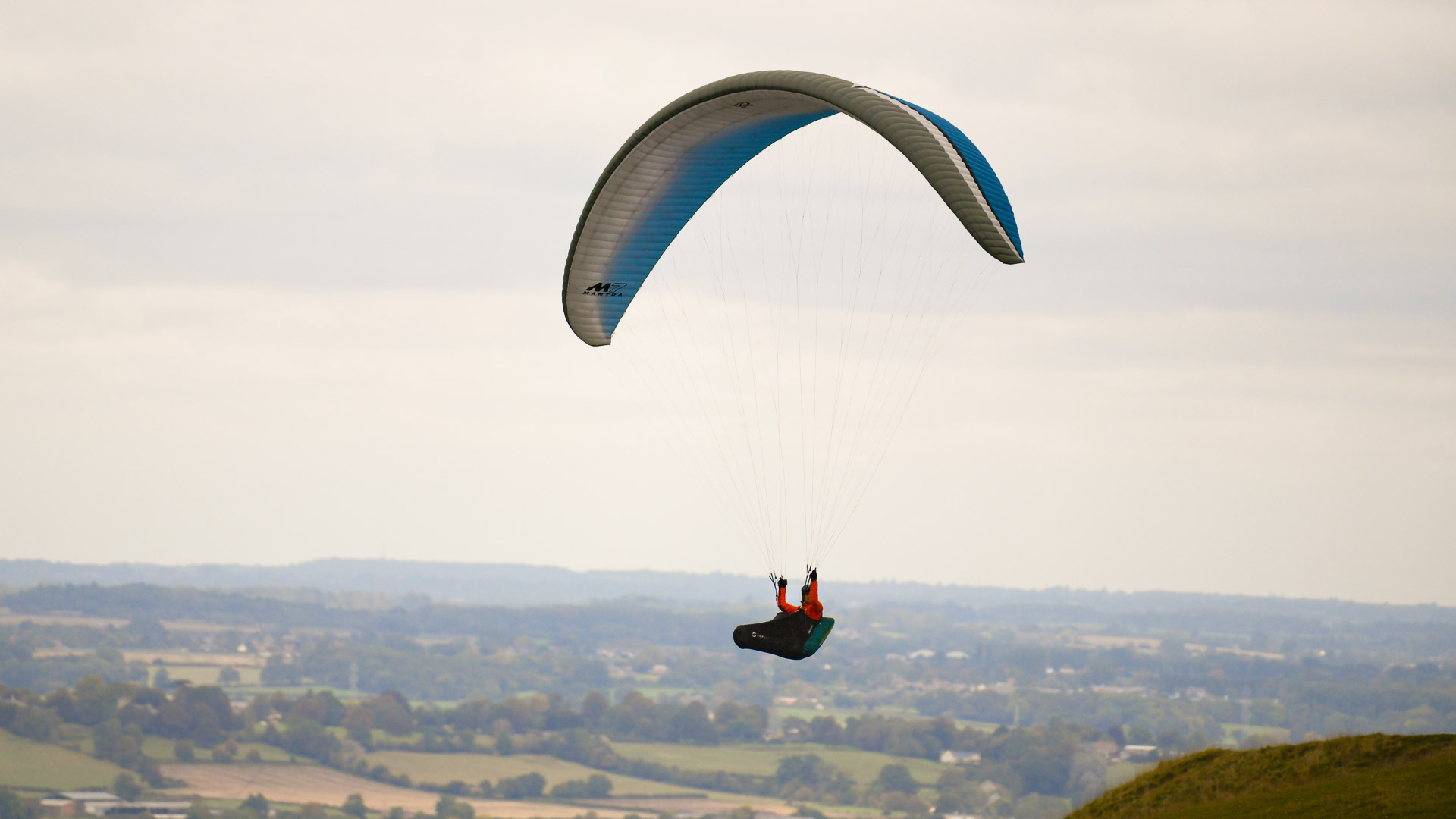 Image is a picture of a paraglider taken with the Nikkor AF-S 200-500mm f/5.6E ED VR lens