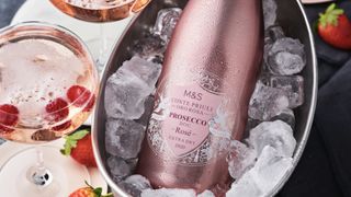 Bottle of M&S Conte Priuli Oro Rosa Prosecco Rosé in an ice bucket with a glass