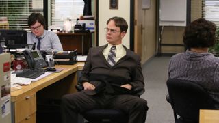 Rainn Wilson as Dwight at his desk in The Office